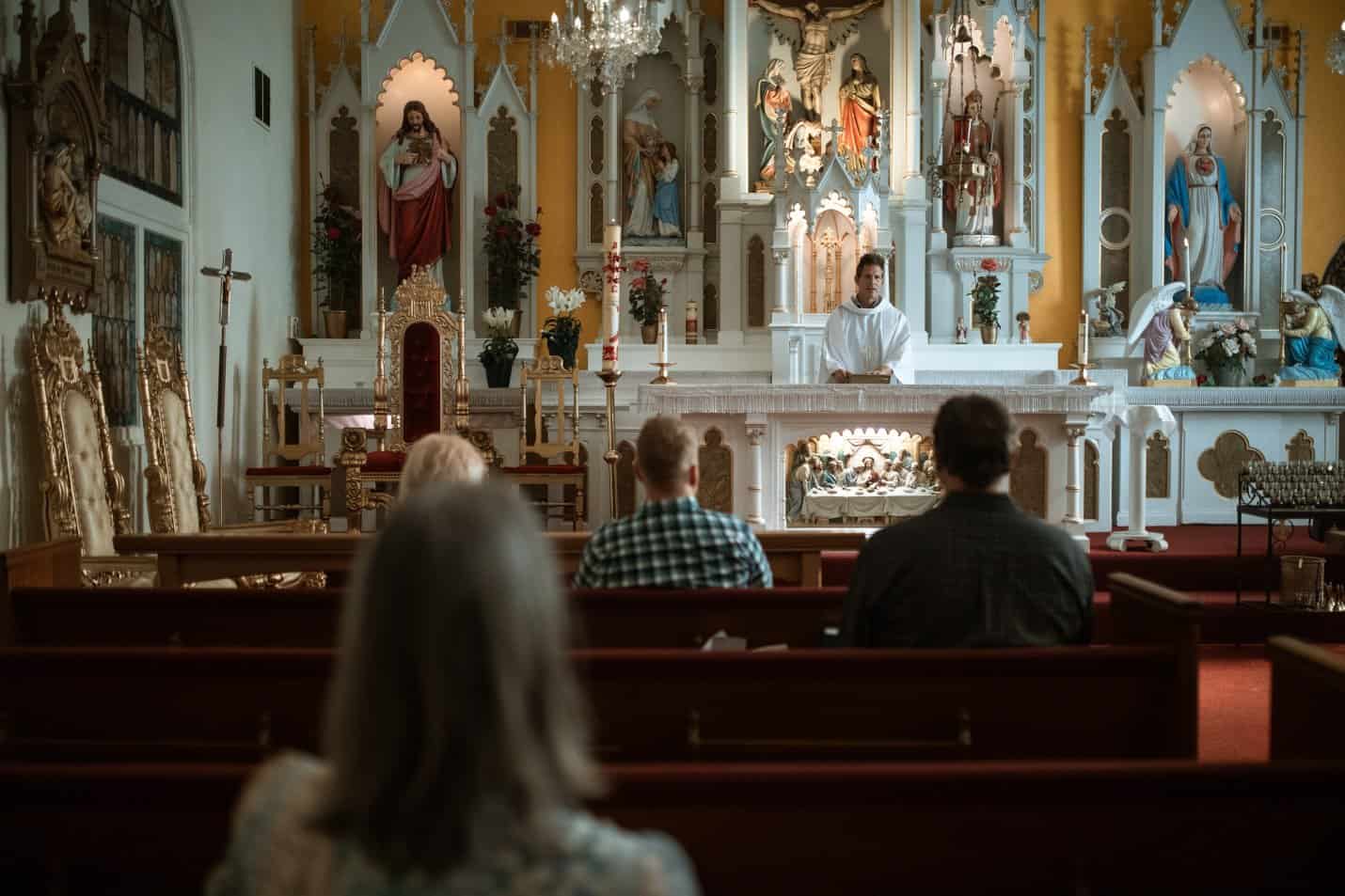 Christians sitting on pews in Church on Sabbath Day